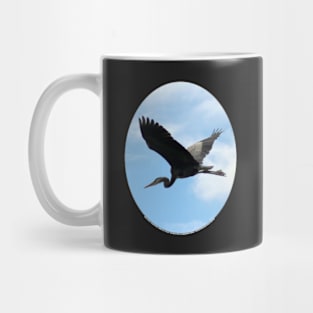 Great Blue Heron Flying Past the Clouds Above Trojan Pond Mug